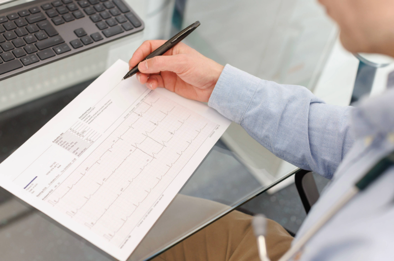 The Importance of Health Screenings 6 Doctor reading ECG