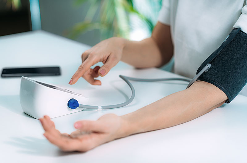 Metabolic Syndrome: What It Is and How Lifestyle Changes Can Make All the Difference 10 Woman measuring blood pressure at home