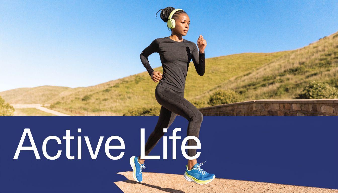 A woman wearing sportswear and headphones running outdoors on a paved path during a sunny day.