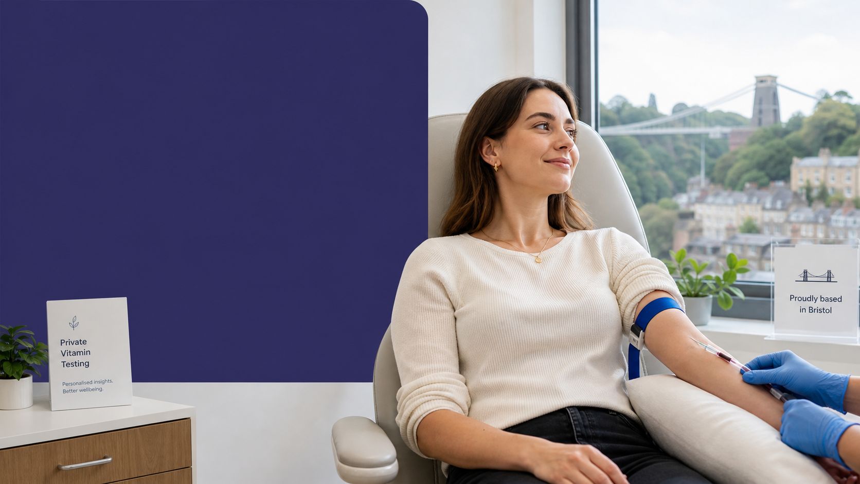 A woman having blood drawn for a private vitamin test at a clinic overlooking Bristol's Clifton Suspension Bridge.